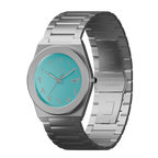 Close-up of the Fayrouz watch face with turquoise finish and elegant Arabic calligraphy indices, Elite Y121 caliber.
