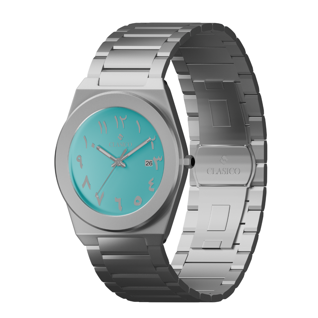 Close-up of the Fayrouz watch face with turquoise finish and elegant Arabic calligraphy indices, Elite Y121 caliber.