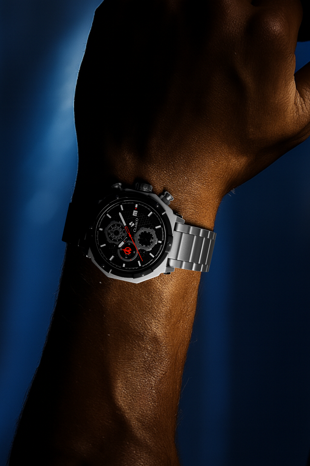 Detailed view of the Clasicio Vortex Silver sports watch on a model's hand, emphasizing its two-tone metallic shine against a luxury background.
